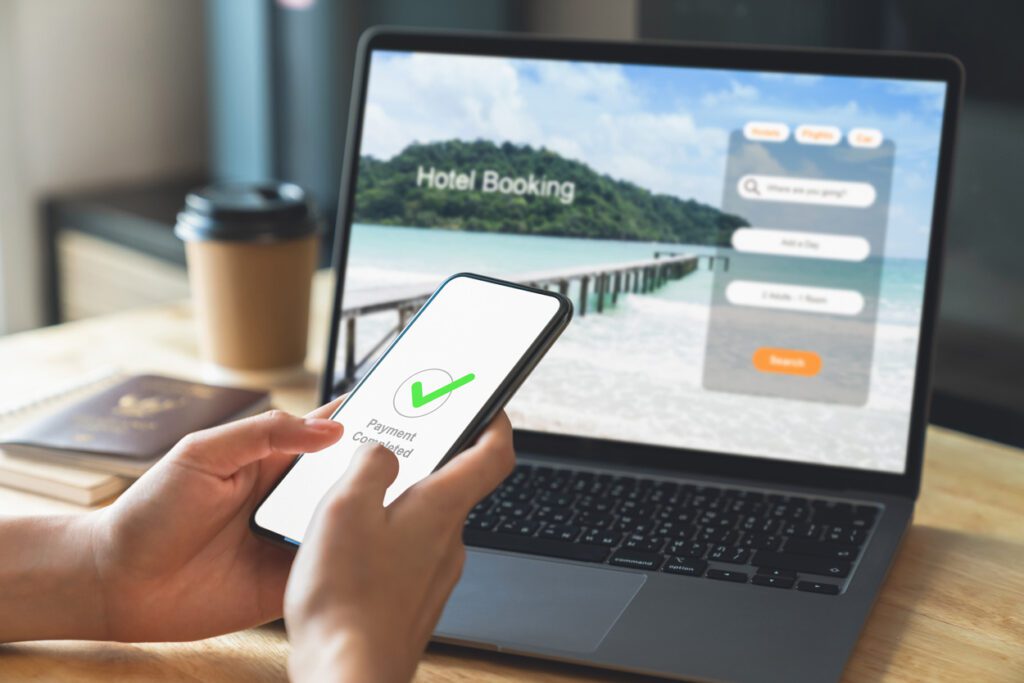 Online hotel booking with mobile payment confirmation representing travel API and GDS integration